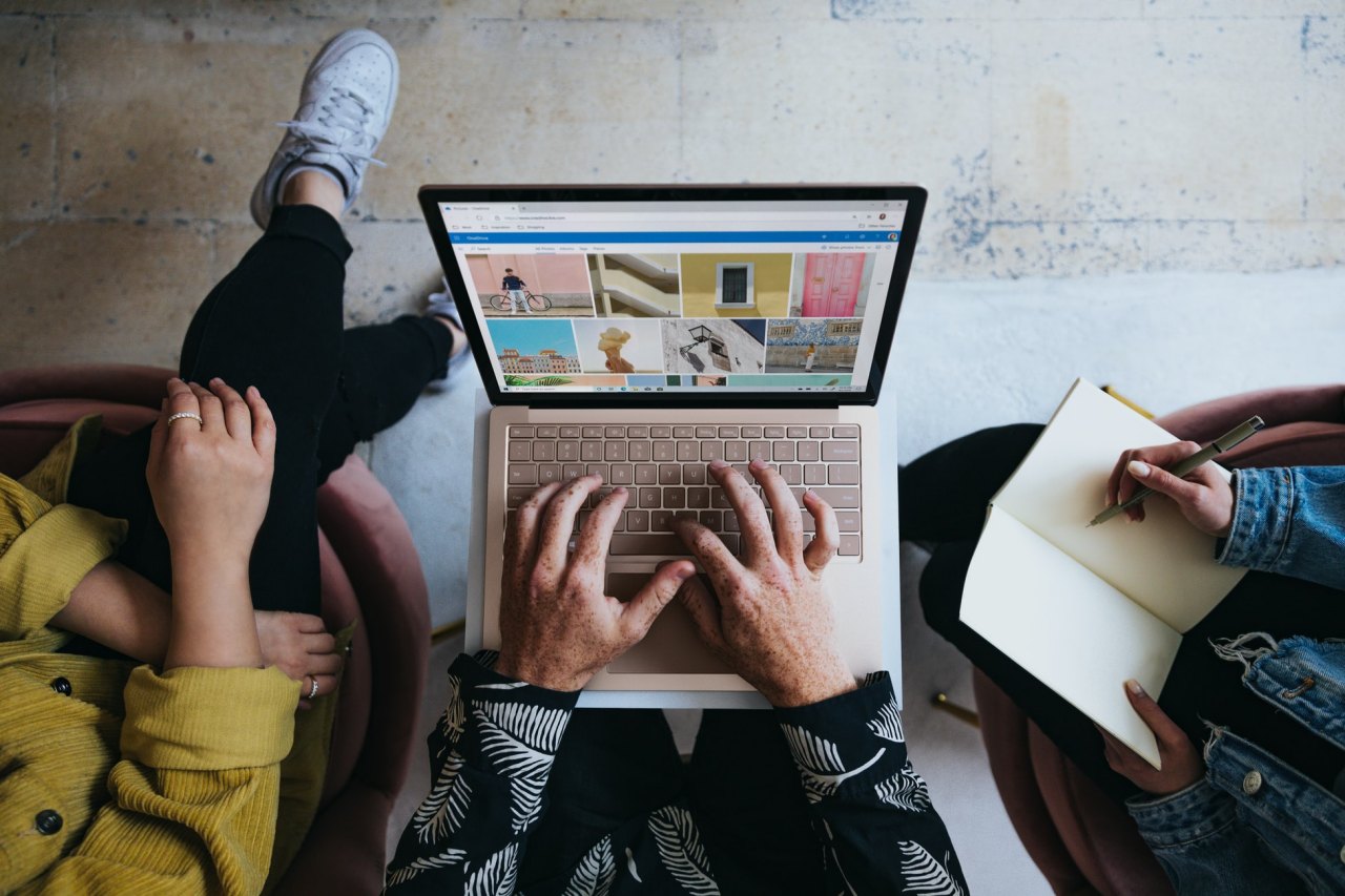 Young people using a laptop.