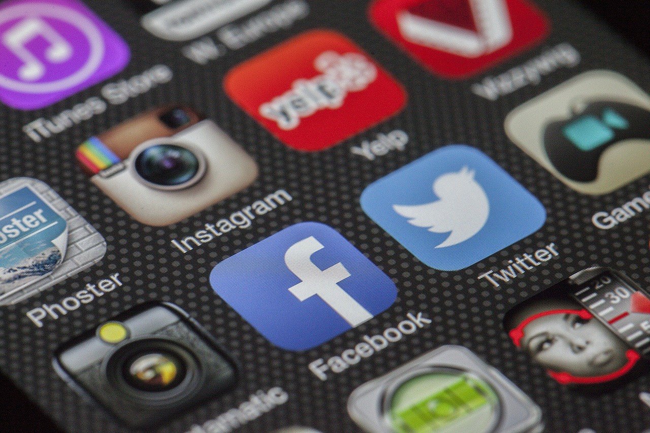 Icons of major social media platforms on a smartphone