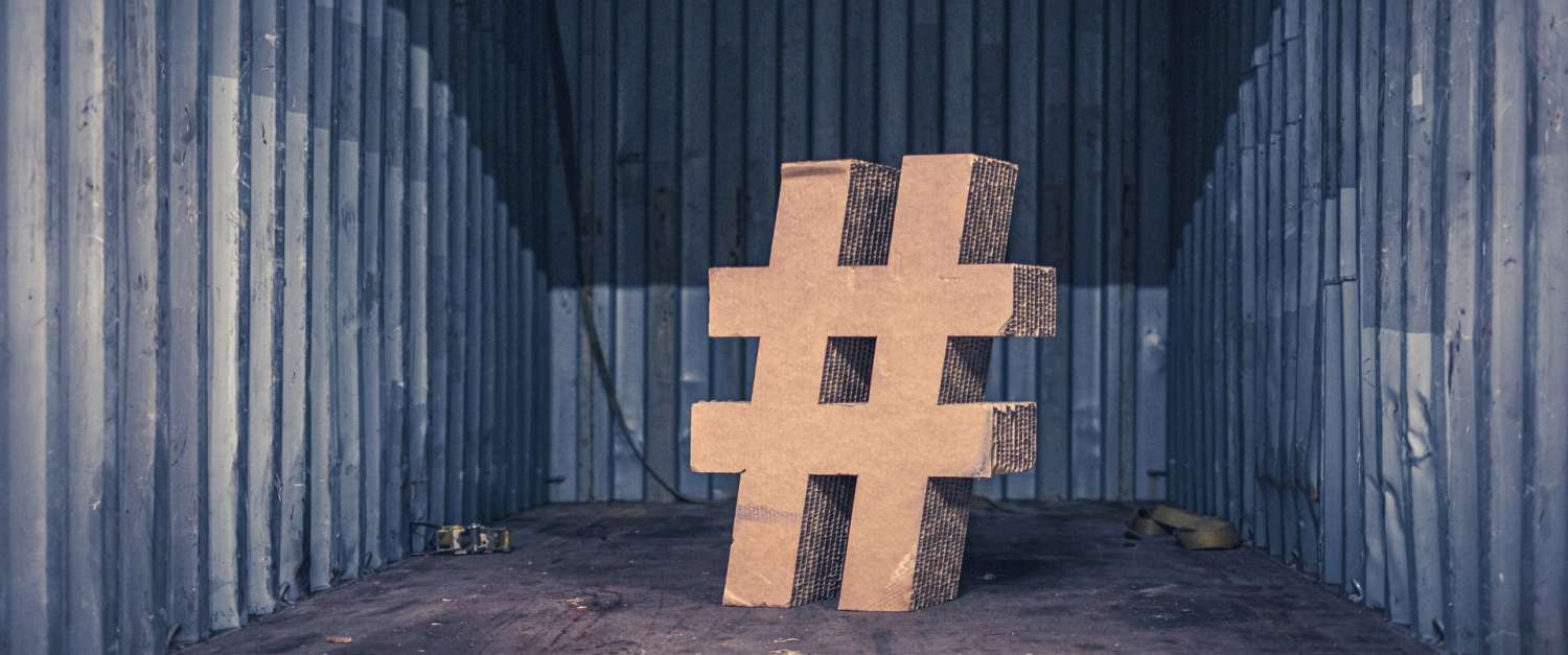 A cardboard hashtag sign.